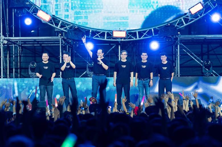 A group of men on a stage with a crowd of people raising their hands

AI-generated content may be incorrect.